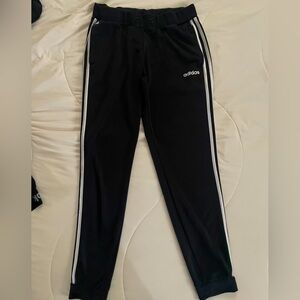 Adidas black jogger with iconic stripes, size medium.